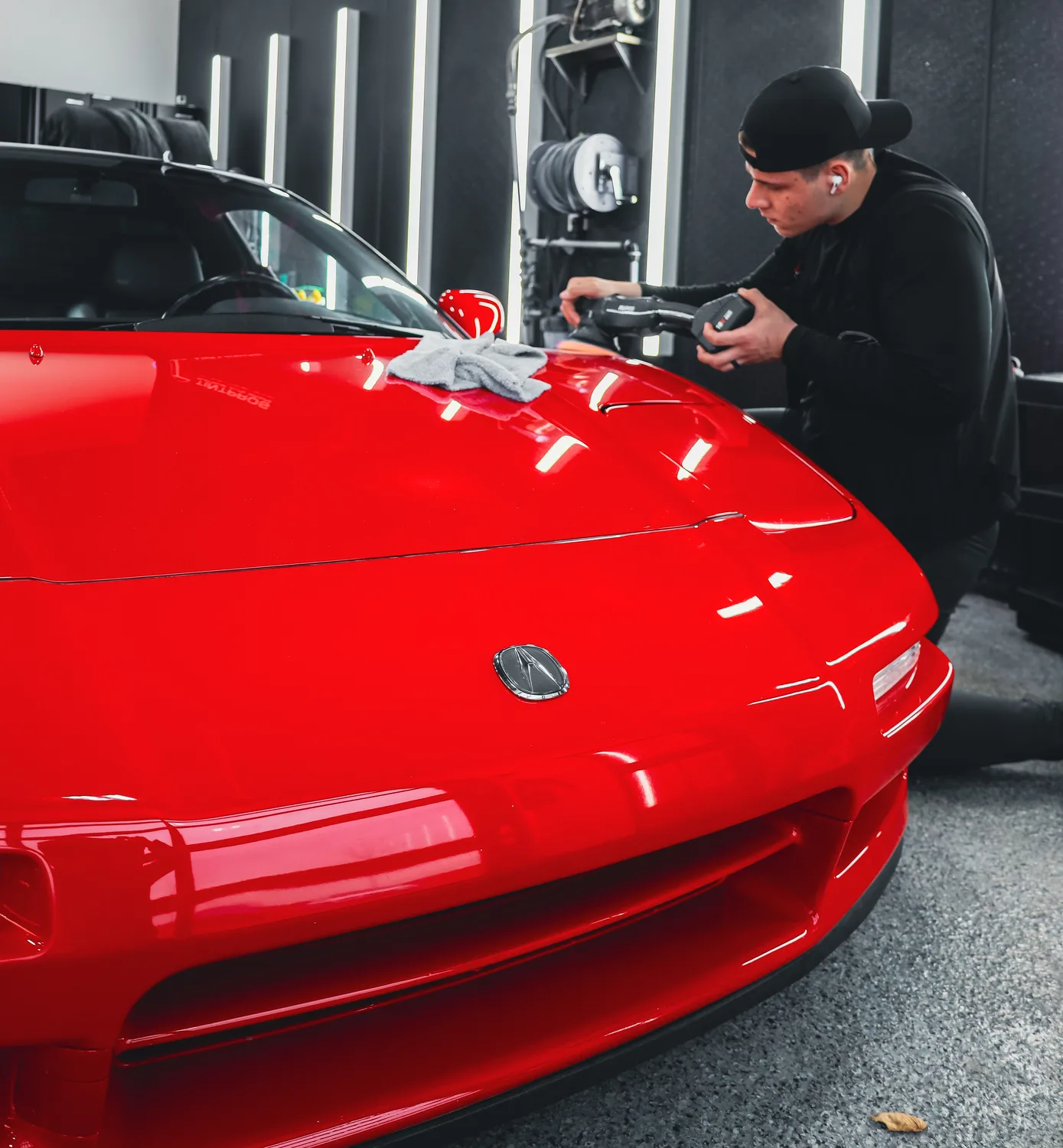 Multi-stage machine polishing on an Acura NSX during paint correction at QMD